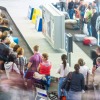 5 Tips For Finding Your Luggage Quickly Lots of people getting luggage at airport.